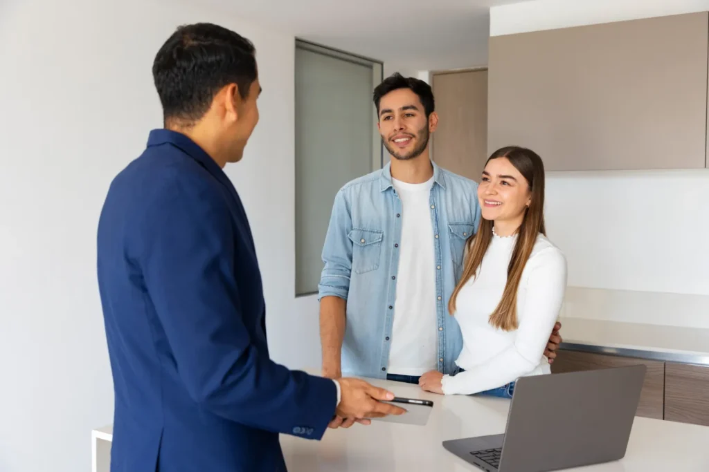 residential property buyers agent talking to a couple looking to buy a house