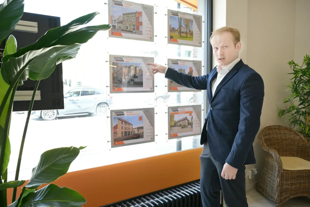 property investment consultants pointing to images of properties